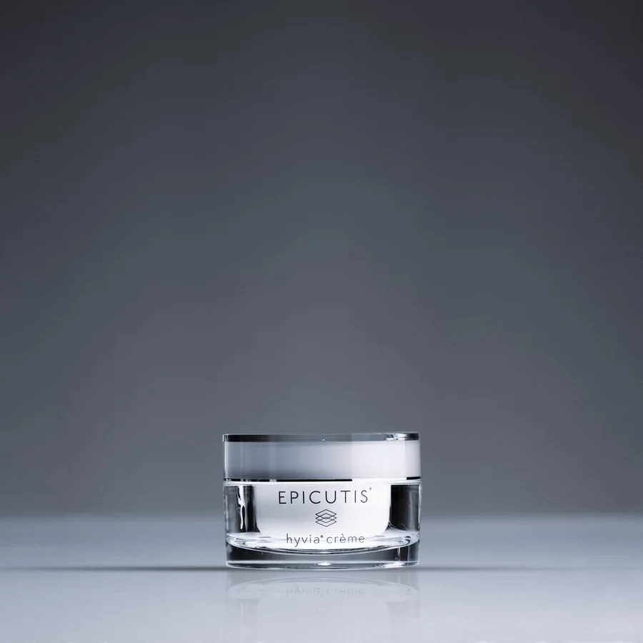 The Epicutis Hyvia Crème jar, photographed on a charcoal ground.