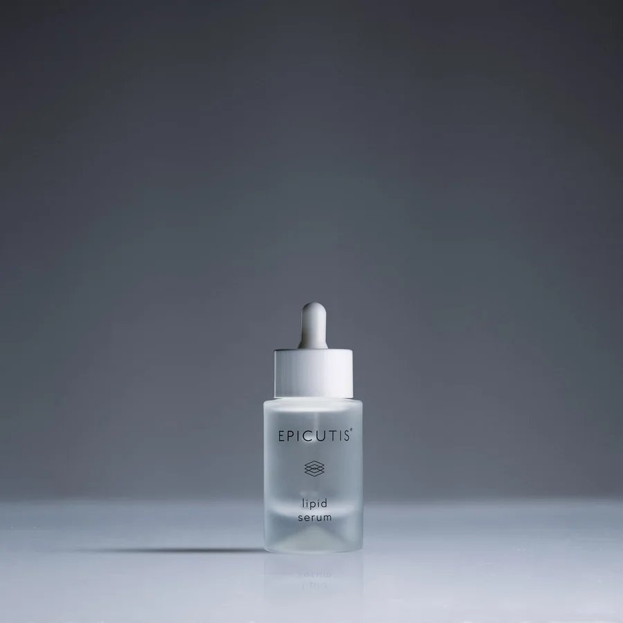 The Epicutis Lipid Serum bottle, photographed on a charcoal ground.