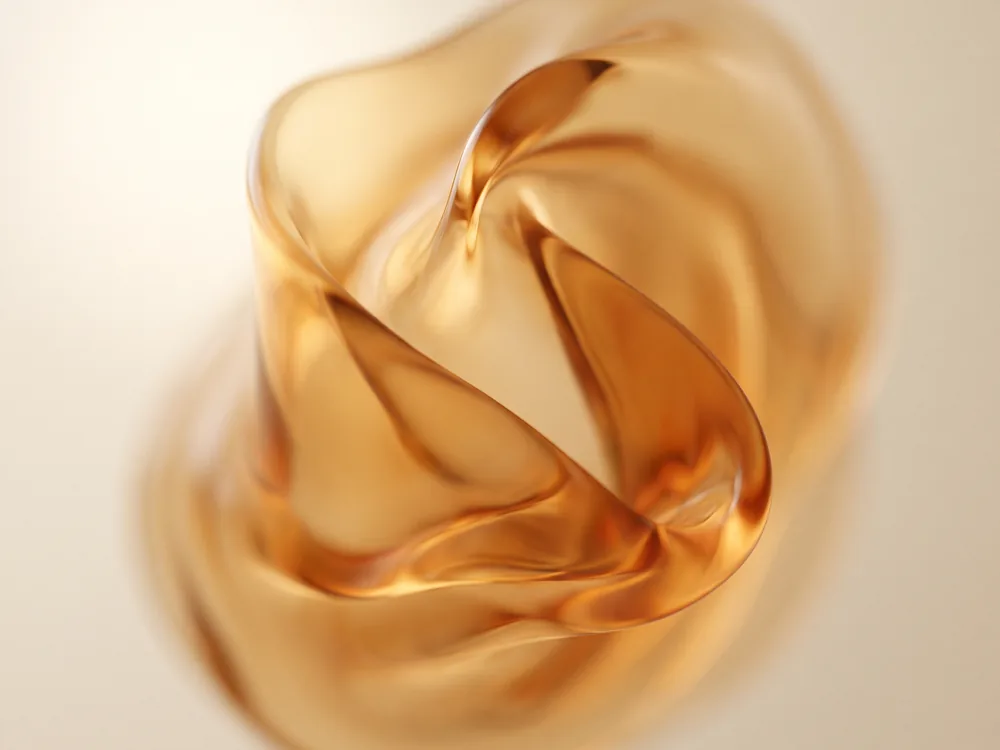 An abstract macro study of amber liquid caught mid swirl.
